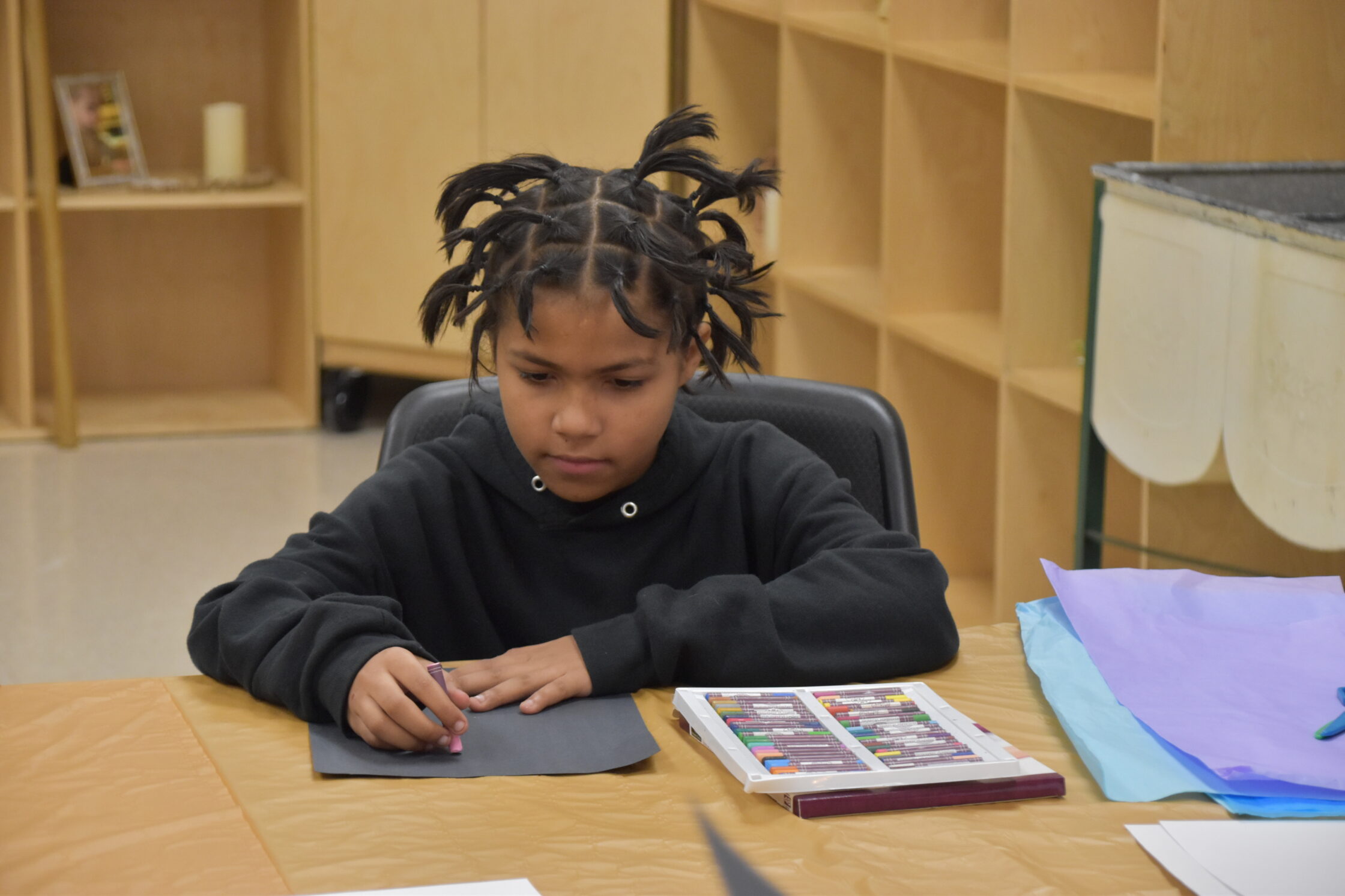 Kid doing art for Mind and Heart