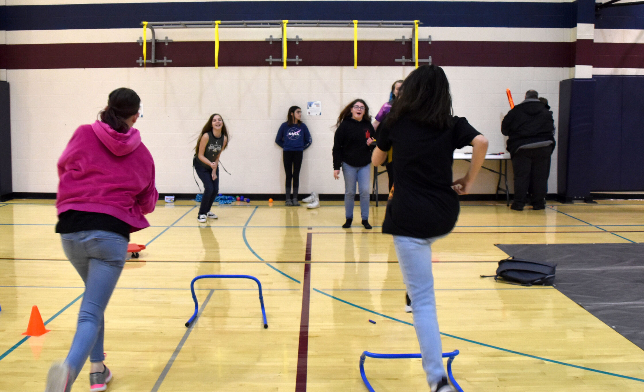 Girls running playing game winter warm up